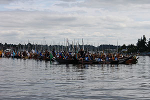 Paddlers in the annual Canoe Journey departing from Nisqually reservation