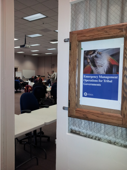 Door with Sign that says Emergency Management Operations for Tribal Governments opening to a classroom